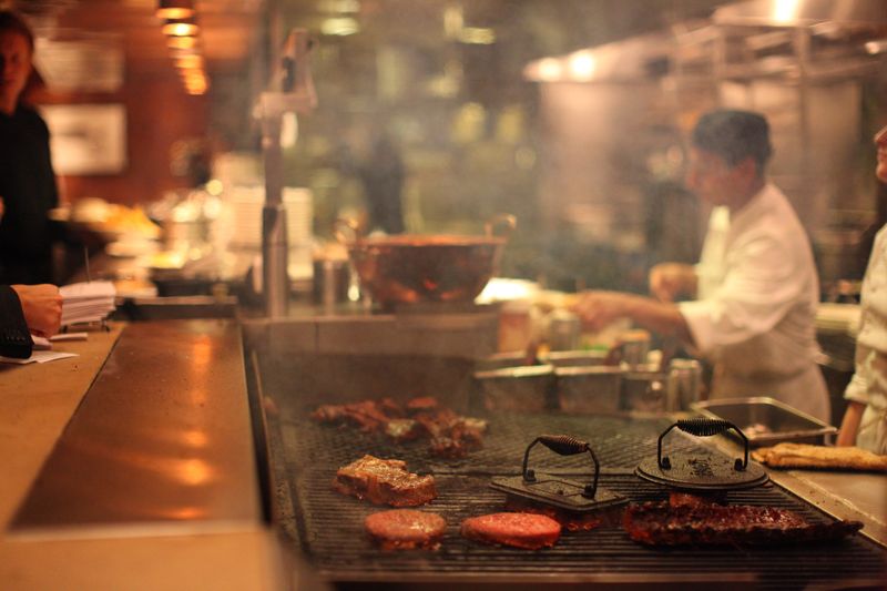 Chef preparing meals in a galley kitchen